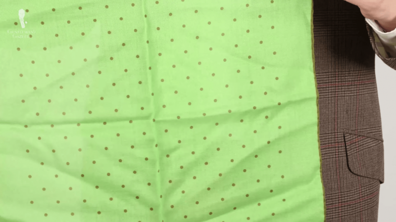 Pochette de costume verte à pois