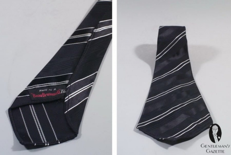 Cravate en soie noire et blanche à rayures jacquard par Beau Brummell - notez les différentes lames avant et arrière de la cravate
