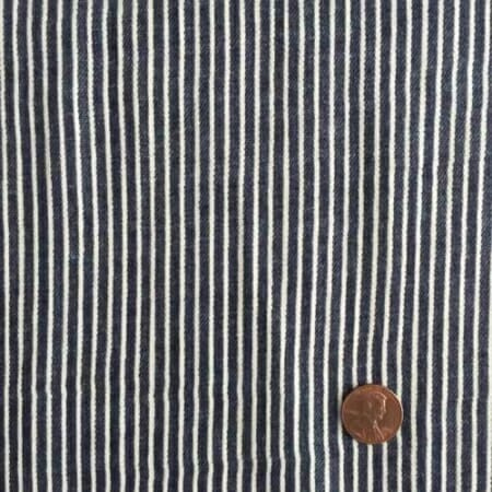 Железничка пругаста тканина, са укљученим новцем који показује величину ткања.