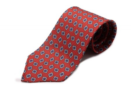 Наранџасто црвена ткана кравата са штампаним дијамантима у плавој и белој боји