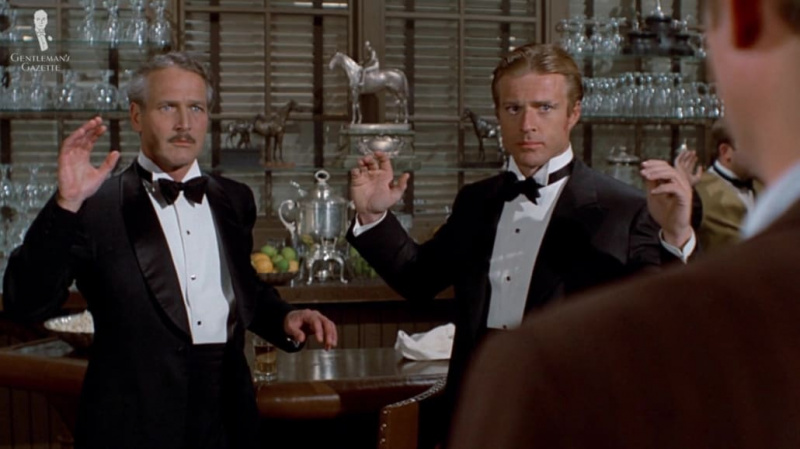 Paul Newman e Robert Redford em trajes de gravata preta