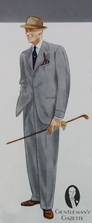 Costume droit en flanelle grise avec revers, chemise winchester rayée, cravate foncée avec motif central, chapeau tyrolien, chaussures en daim marron et pochette à pois bleu marine