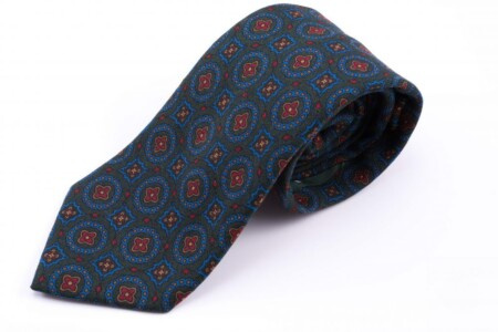Challis-slips i ull i mörkgrönt med blått, gult och orange mönster