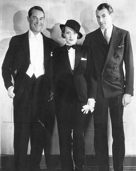  Maurice Chevalier en cravate blanche, Marlene Dietrich en cravate noire et Gary Cooper en costume rayé 6x1