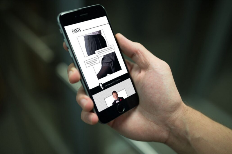 Uma imagem do guia de gravata preta exibida em um celular com informações sobre calças