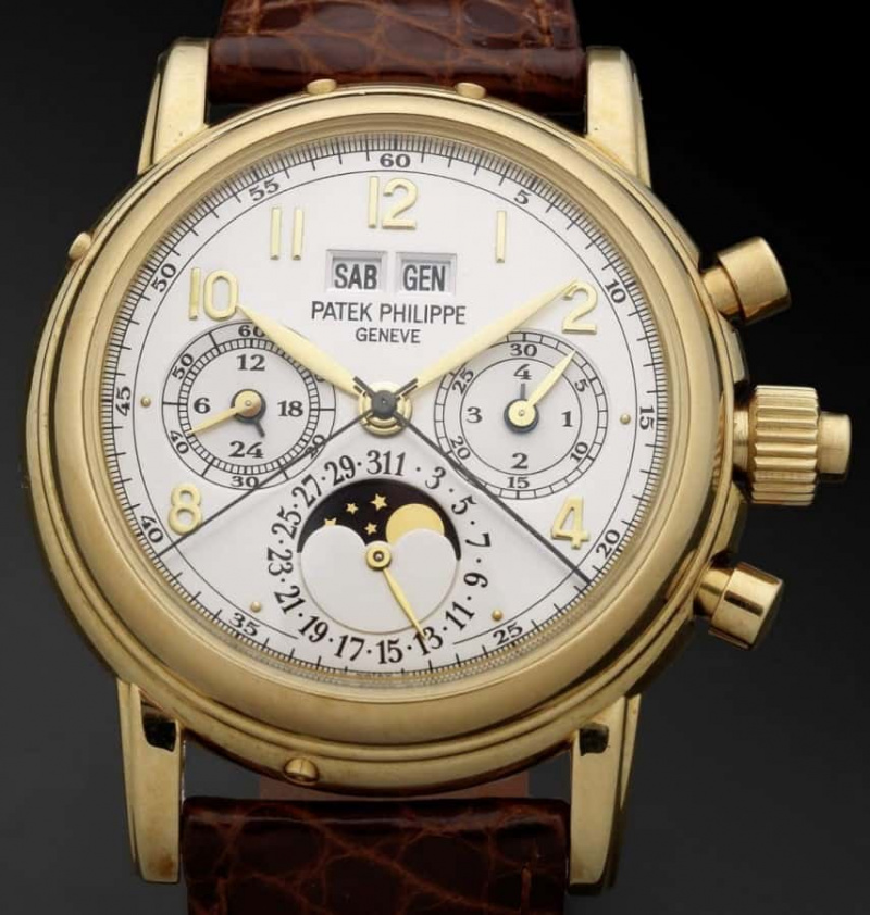 Patek Philippe. Une très belle et rare montre-bracelet chronographe à rattrapante en or 18 carats à remontage manuel avec calendrier perpétuel et phases de lune
